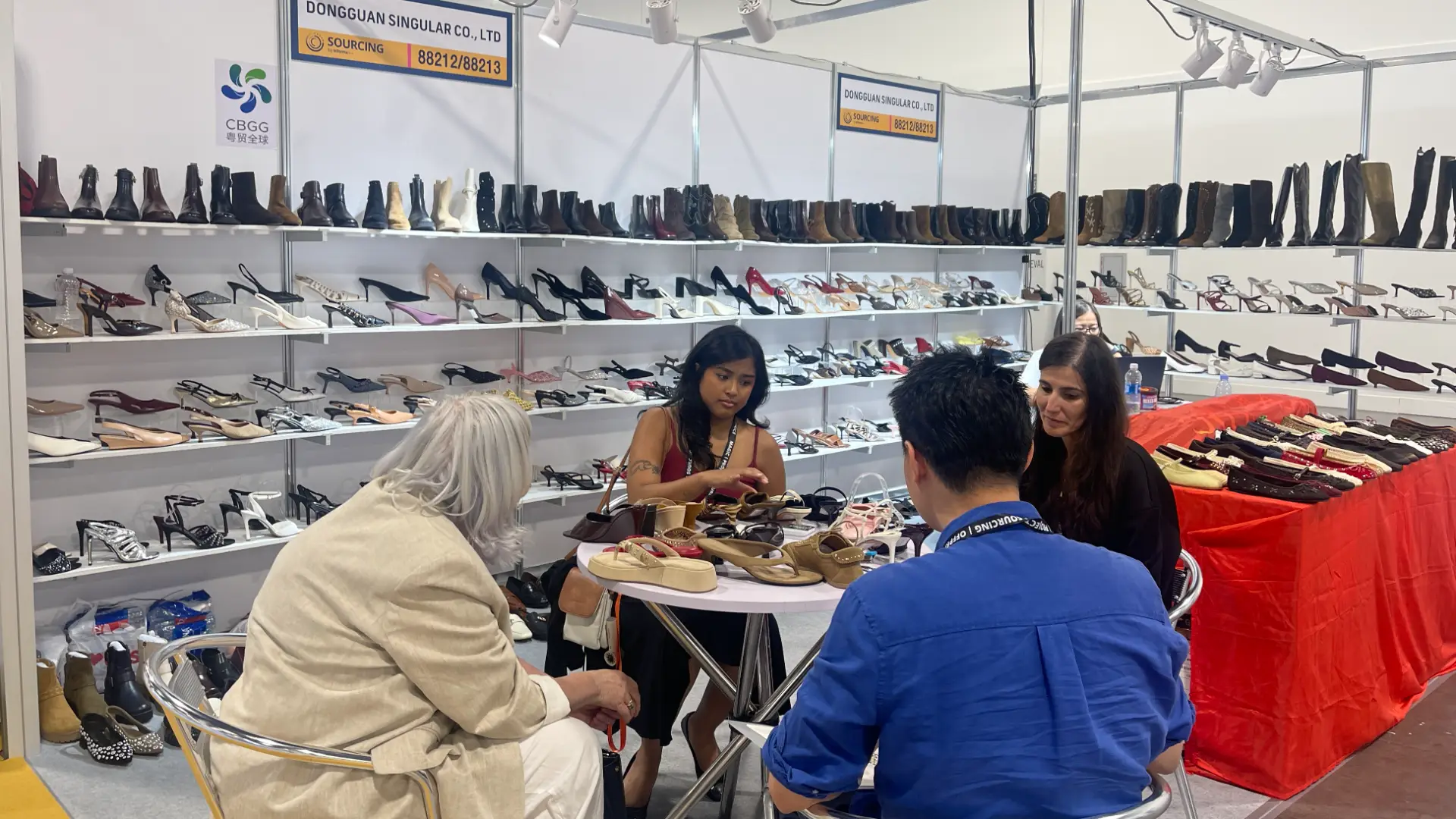 SINGULAR team meeting footwear buyers at MAGIC Las Vegas.webp